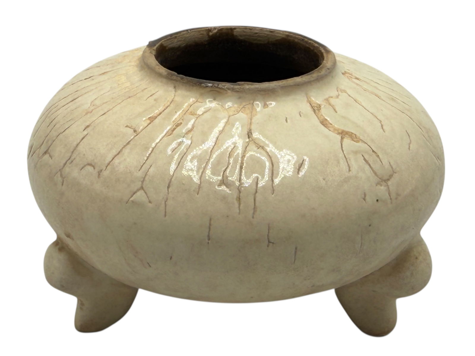 A Cream-glazed marbled pottery tripod jar: H: 2 1/2 inches W: 3 7/8 inches