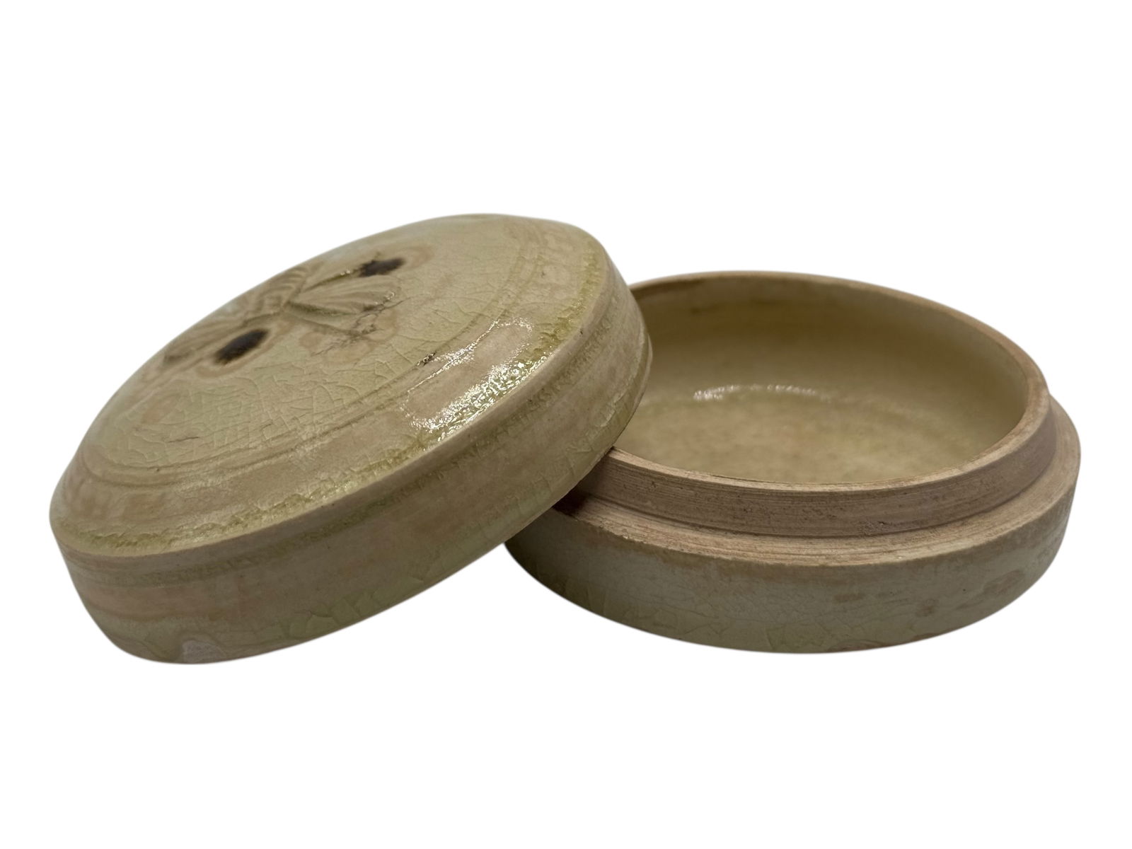 A celadon-glazed 'butterfly' box and cover, Tang: A rare celadon-glazed 'butterfly' box and cover, Tang dynasty / Five dynasties Style H: 1 7/8 inches W: 3 1/8 inches