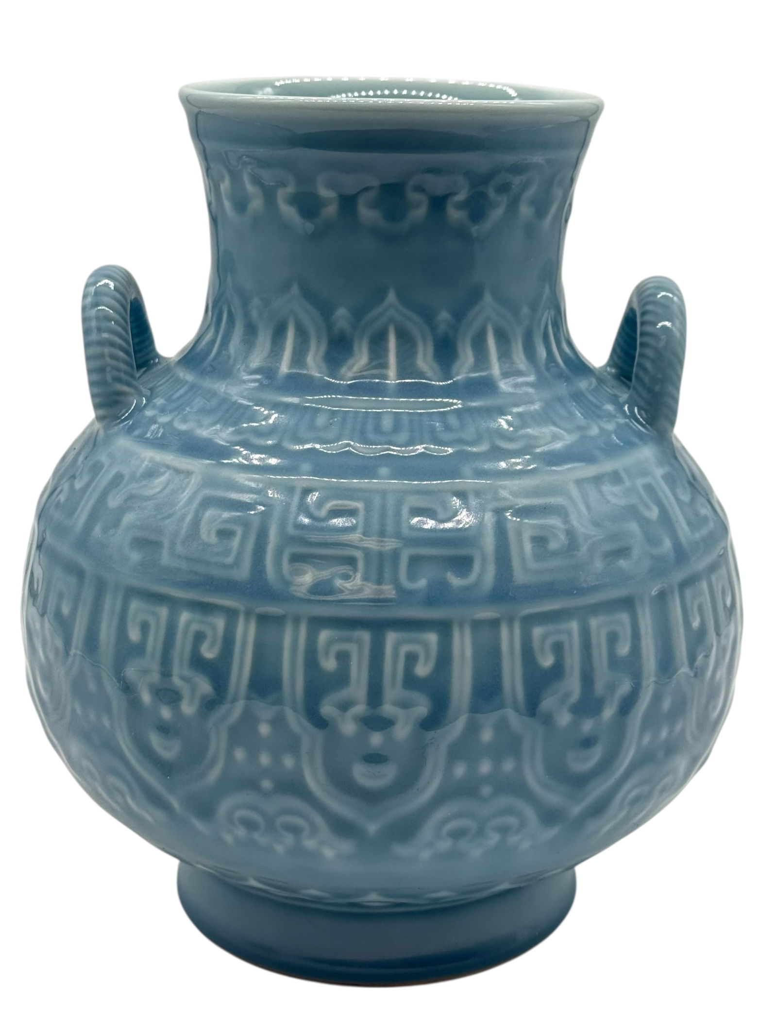 A Chinese Blue-Glazed Jar with Ring Handle, Qinglo: Of compressed globular form rising to a short waisted neck, the shoulder applied with a pair of ribbed loop handles, Qianlong Marks H: 10 1/4 inches W: 9 inches