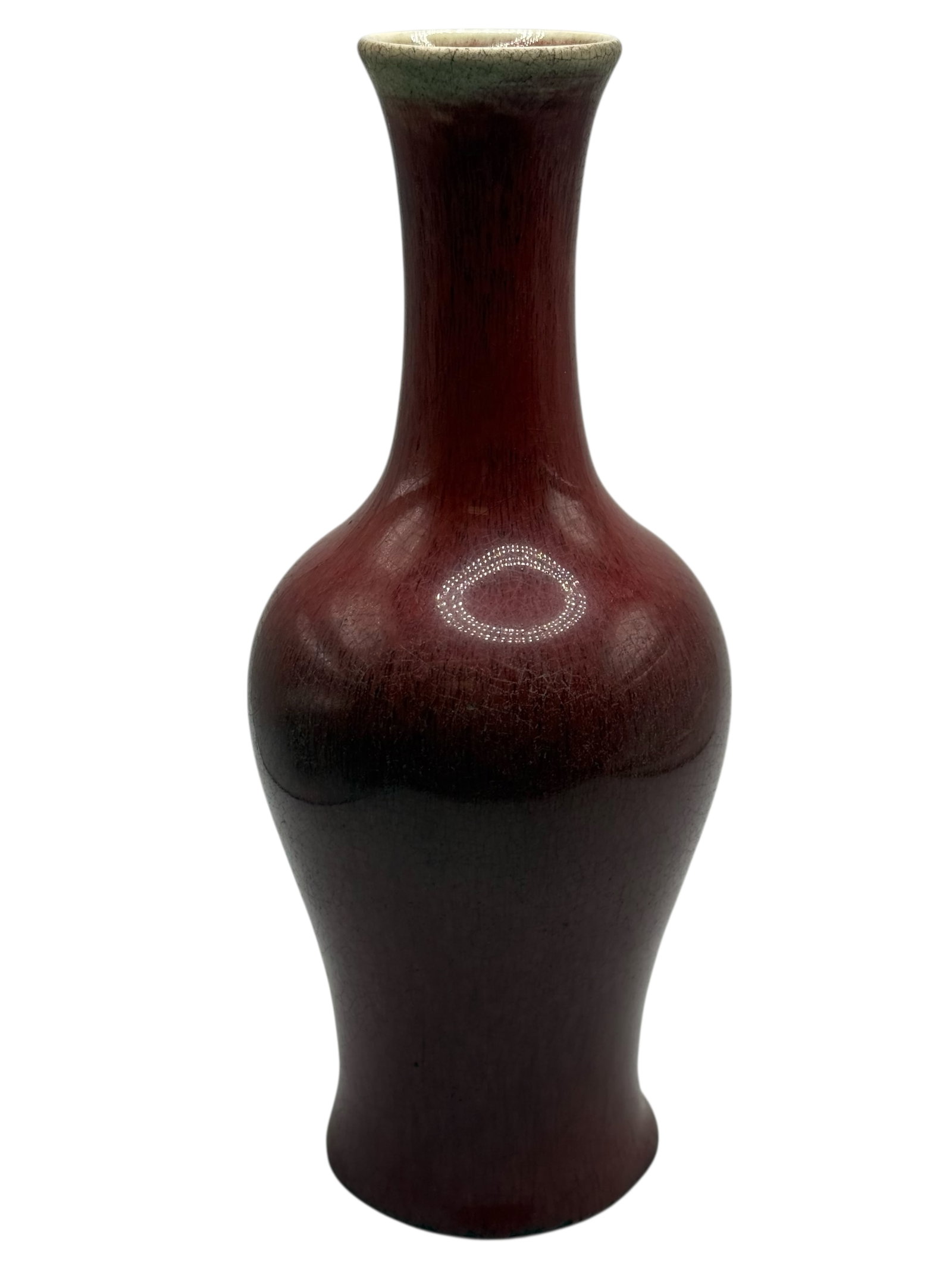 A Chinese Flambé-Glazed Red Bottle Vase: Of elongated baluster form with a slender neck H: 9 inches W: 3 3/4 inches