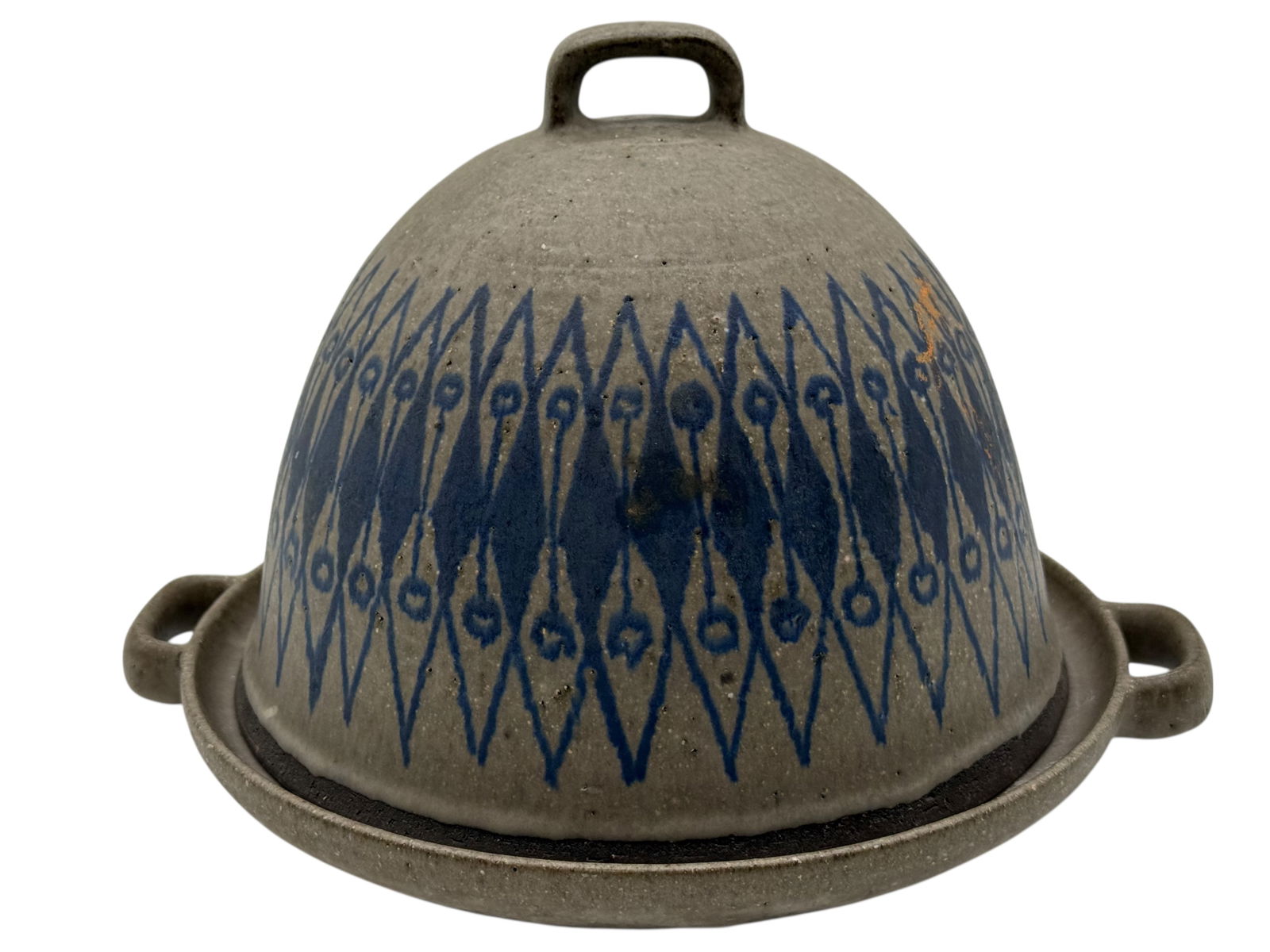 A Pottery Covered Dish with Blue Geometric Decorat: The domed cover and matching base decorated with repeating blue diamond and dot motifs. H: 7 1/4 inches W: 11 1/2 inches