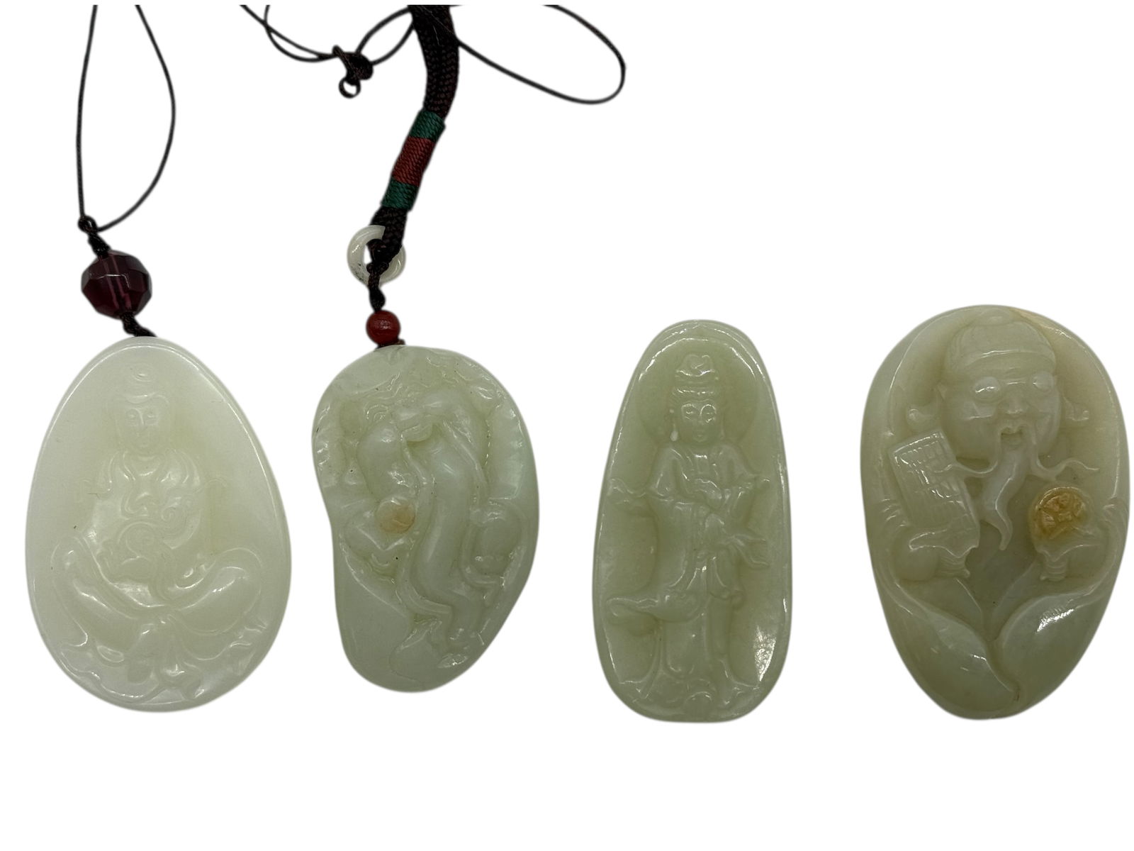 A Group of Four Chinese Celadon Jade Carved Pendan (1 of 8)
