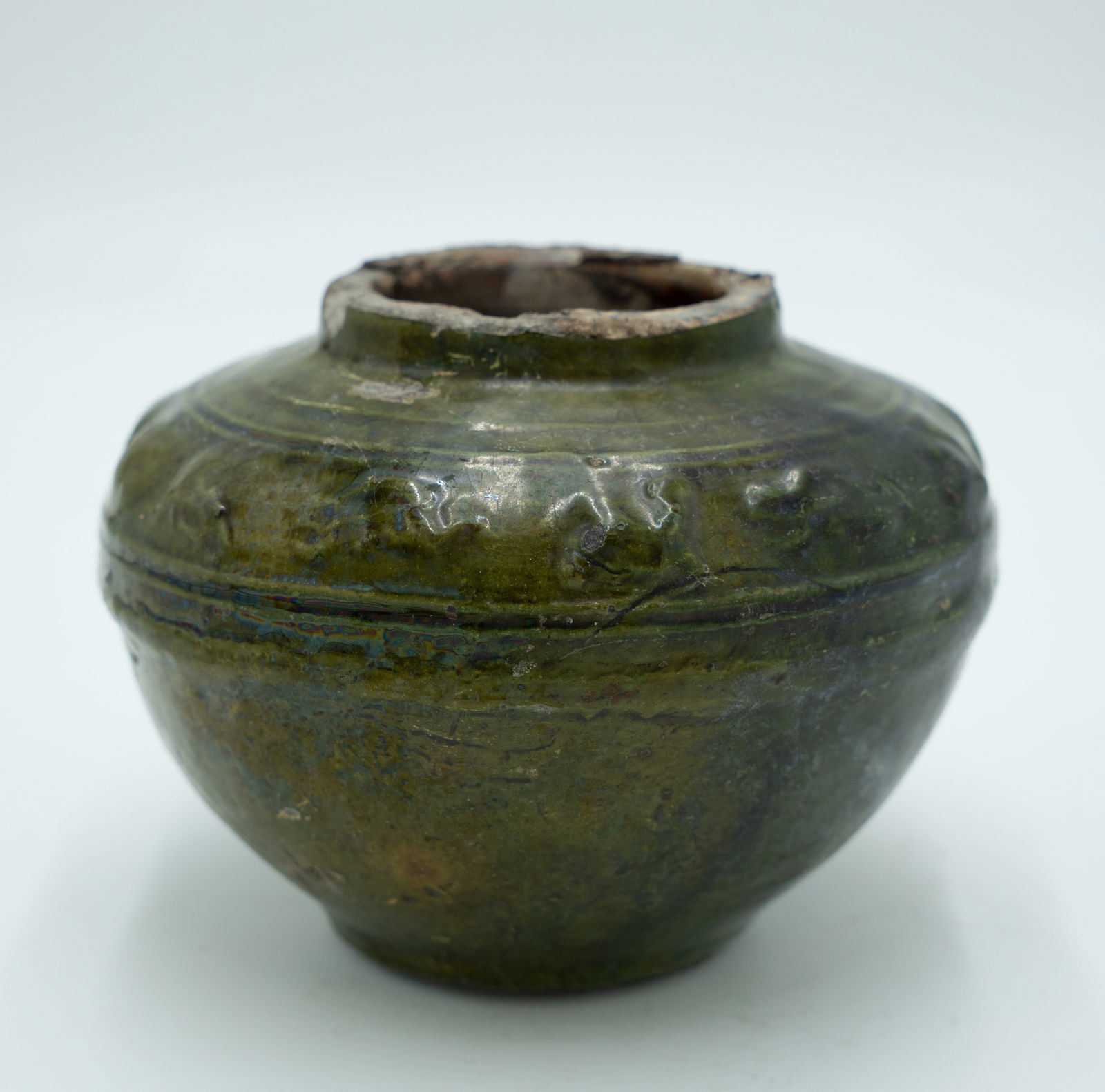 A Chinese Green Glazed Jar: H: 4 inches W: 8 5/8 inches