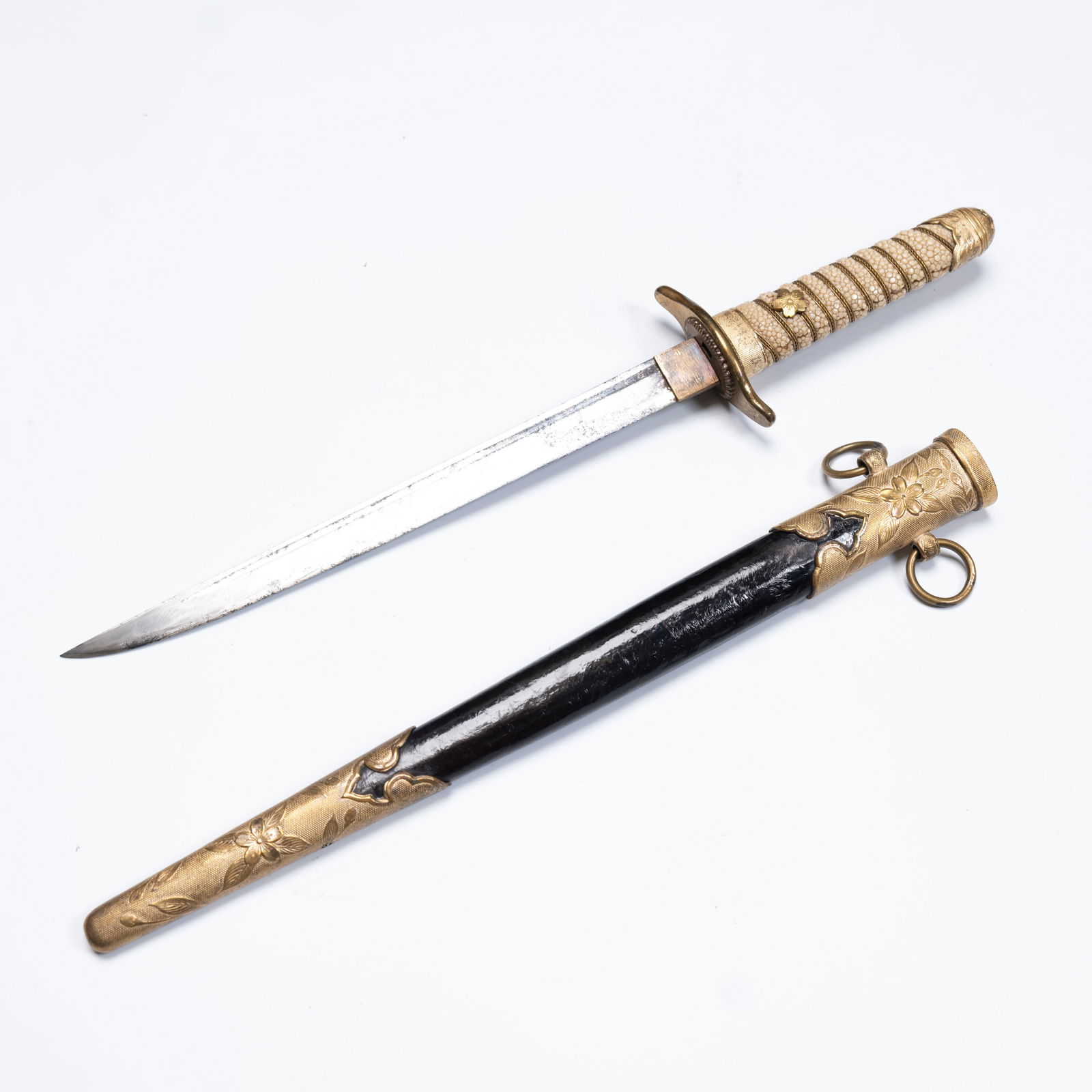 A Japanese Tanto with Ray-Skin Hilt and Gilt Metal: A Japanese Tanto with Ray-Skin Hilt and Gilt MetalL: 16 3/8 inches W: 2 1/2 inchces