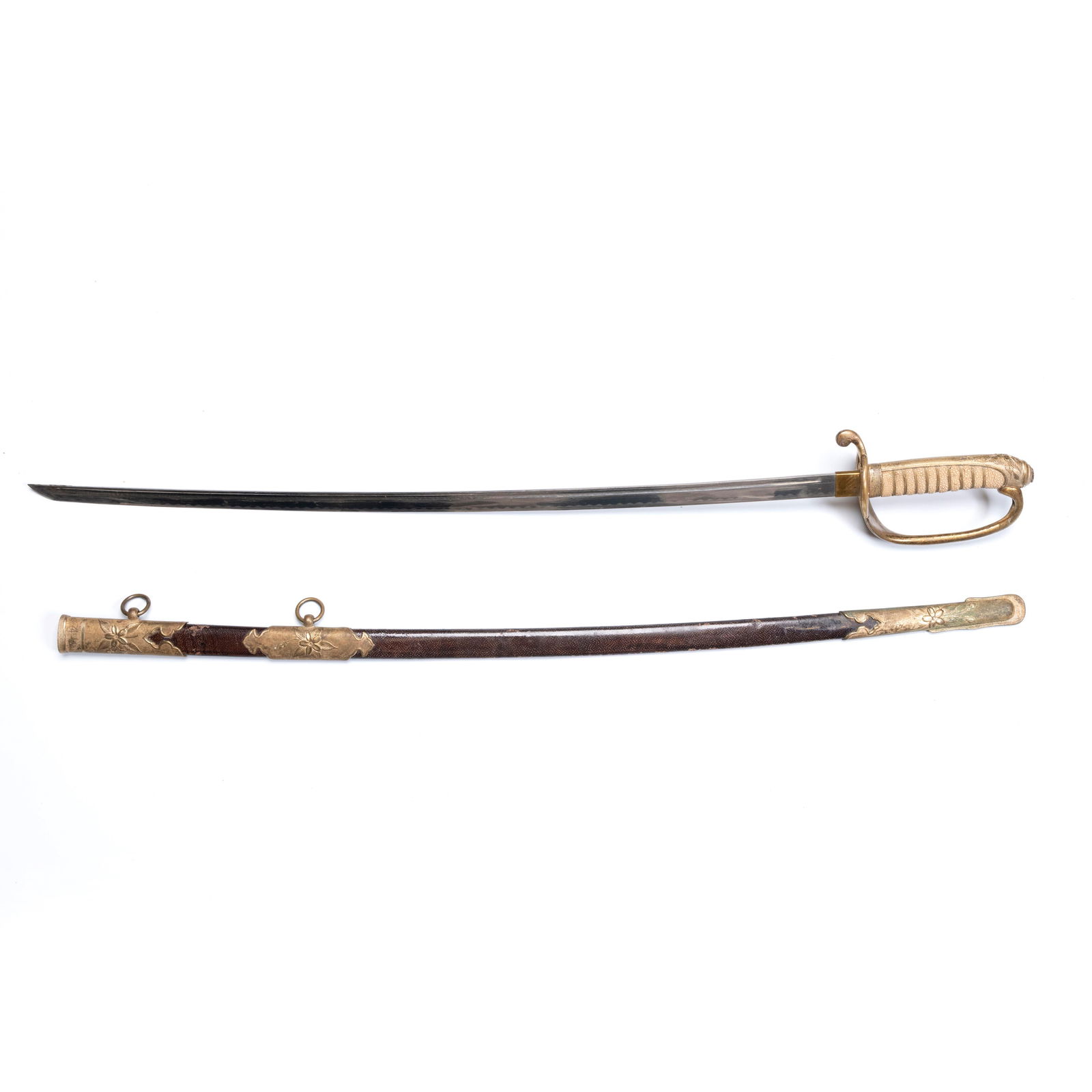 A Japanese Army Officer’s Dress Sword with Ray-Ski: A Japanese Army Officer’s Dress Sword with Ray-SkiA Japanese Army Officer’s Dress Sword with Ray-Skin Grip and Gilt Floral Mounts L: 34 inches W: 3 7/8 inchces