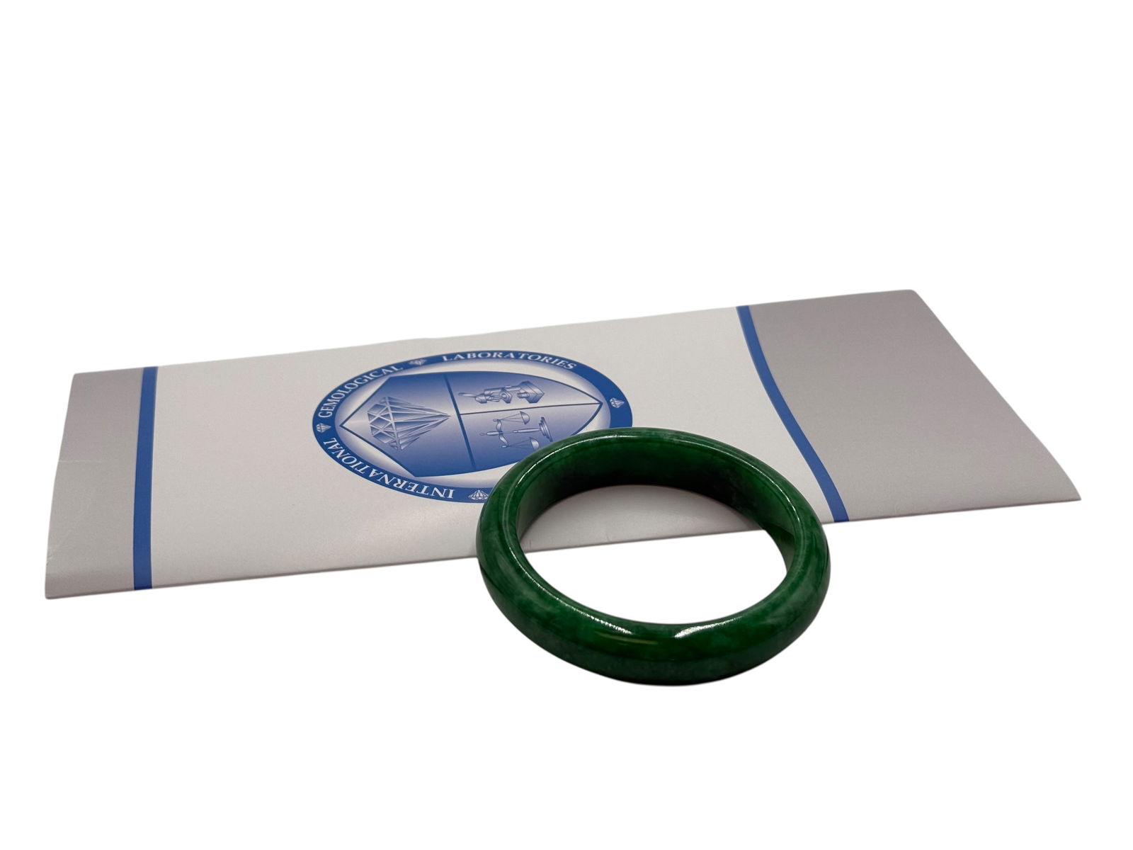 AIGL Certified Natural Jadeite Bangle: AIGL Certified Natural Jadeite BangleAIGL Certified Natural Jadeite Bangle Outside Diameter: 74.2 mm Inside Diameter:57.4 mm Weight : 61.5 grams