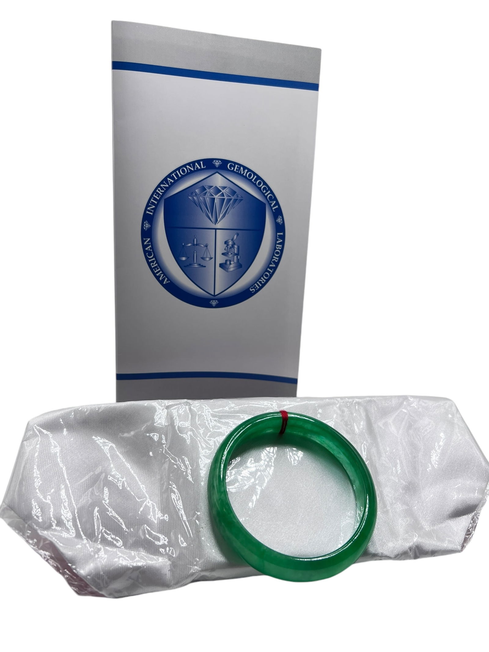 AIGL Certificate Jade Bangle Bracelet: AIGL Certificate Jade Bangle BraceletInner diameter approximately 58.9 mm, Outside Diamater: 73.2 cm Weight 52.6 grams