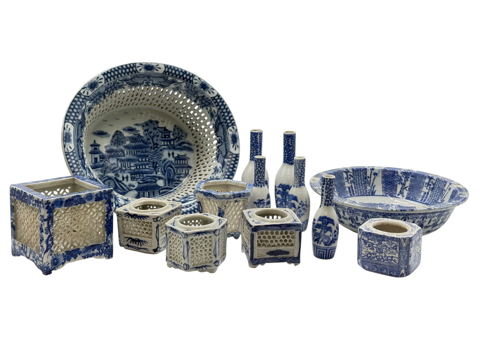 Grouping of Blue and White Openwork Porcelain: Grouping of Blue and White Openwork PorcelainGrouping of Blue and White Reticulated Porcelain and Miniature Vases The Largest Size the bowl : H: 4 inches W:10 iinches