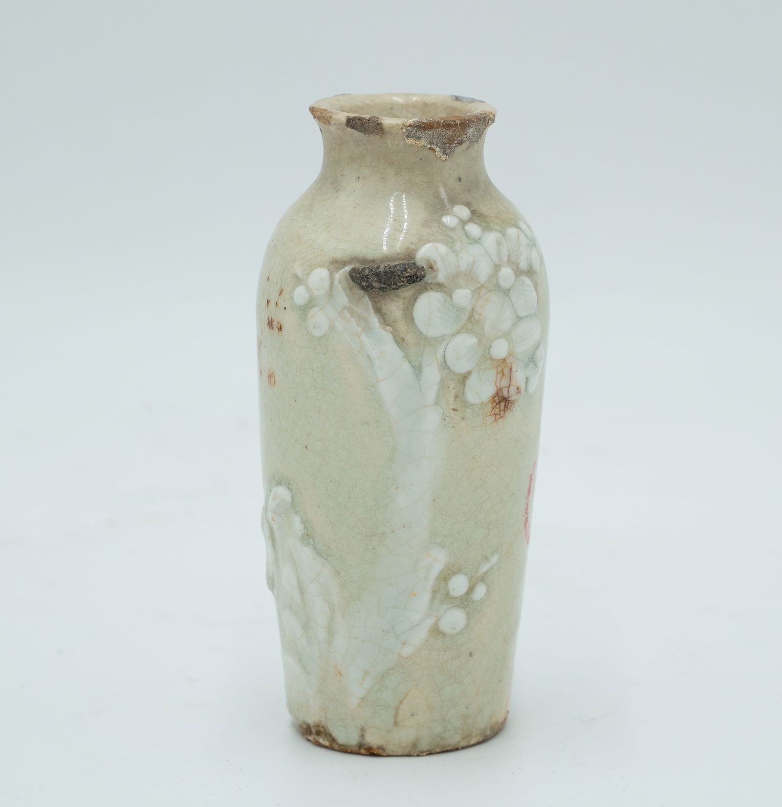 Chinese Vase with Plum Blossom Relief Design: Chinese Vase with Plum Blossom Relief DesignH: 4 1/2 inches W: 2 1/8 inches