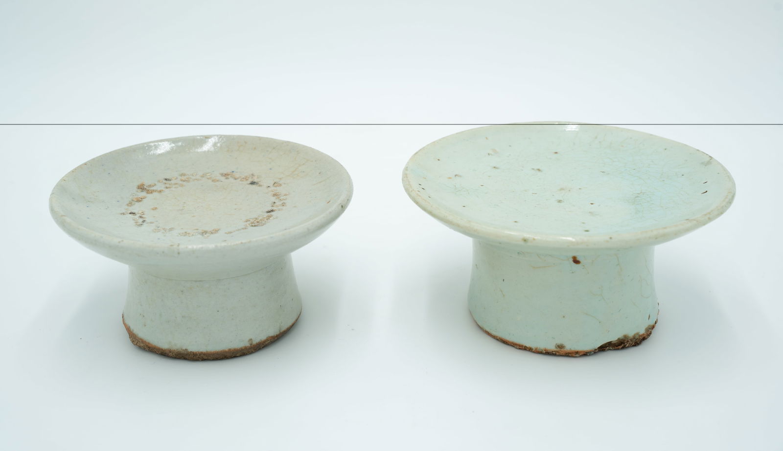 Two Korean White Glazed High Foot Dishes: Two Korean White Glazed High Foot DishesTwo Korean White Glazed High Foot Dishes The Largest: H: 2 3/4 inches D: 5 5/8 inches