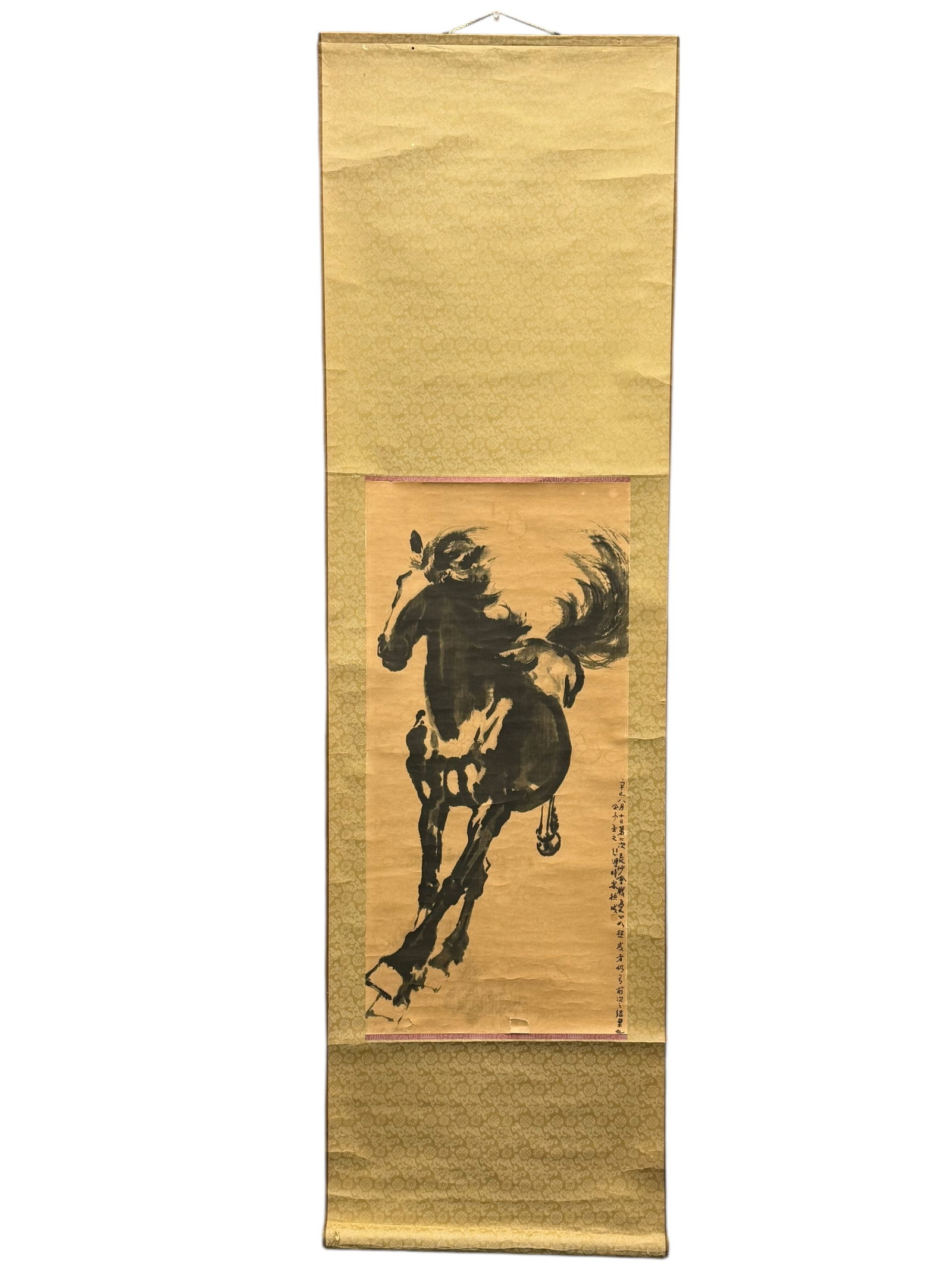 A Chinese Horse Painting Hanging Scroll: A Chinese Horse Painting Hanging ScrollInk on paper portraying a galloping horse, with inscription and seals, mounted as a hanging scroll. Frane: 57 inches , 17 inches The painting: 27 1/2 13
