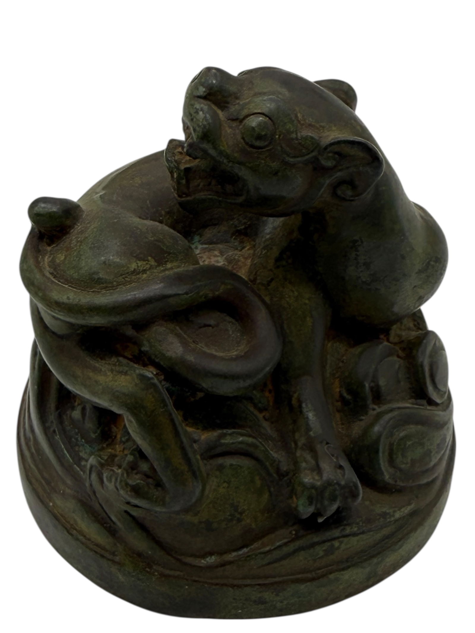 A Chinese Bronze Mythical Beast: A Chinese Bronze Mythical BeastCast as intertwined animal figures on a rounded base. H: 3 inches W: 2 1/2 inches