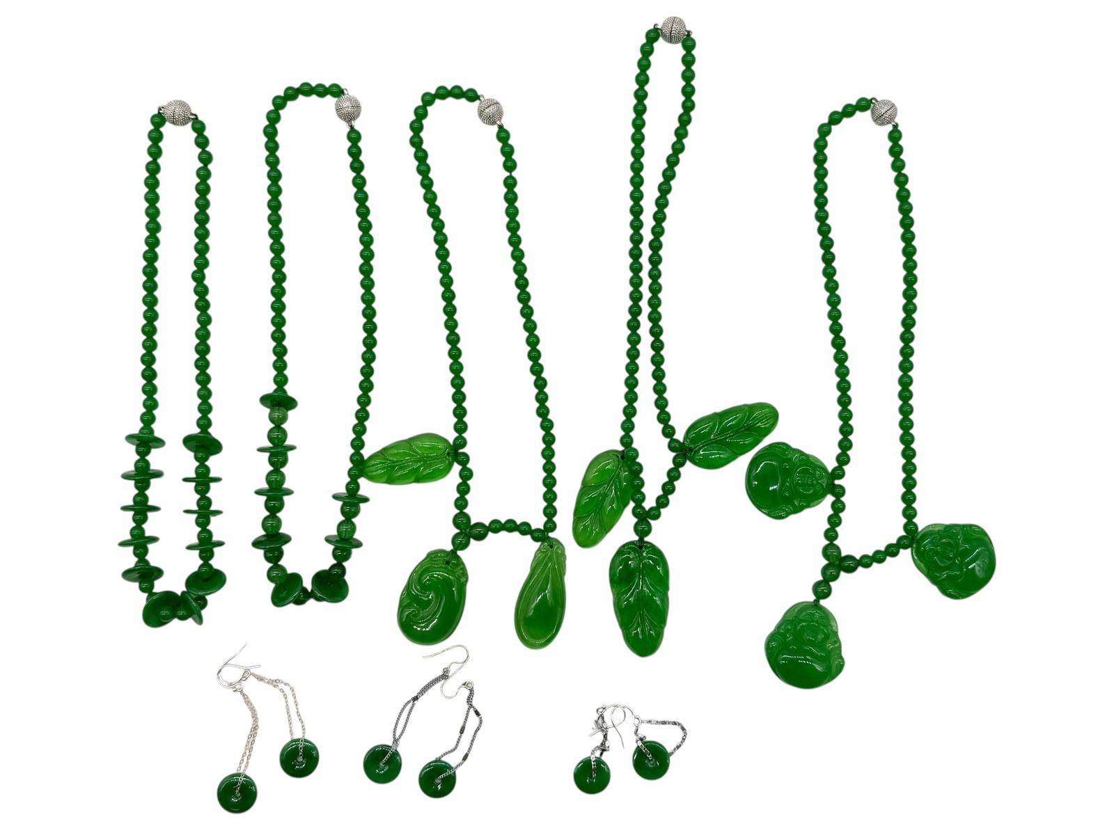 A Group of Green Stone Bead Necklaces with Carved: A Group of Green Stone Bead Necklaces with CarvedA Group of Green Stone Bead Necklaces with Carved Pendants H : 10 1/2 in ( 26.67 cm )
