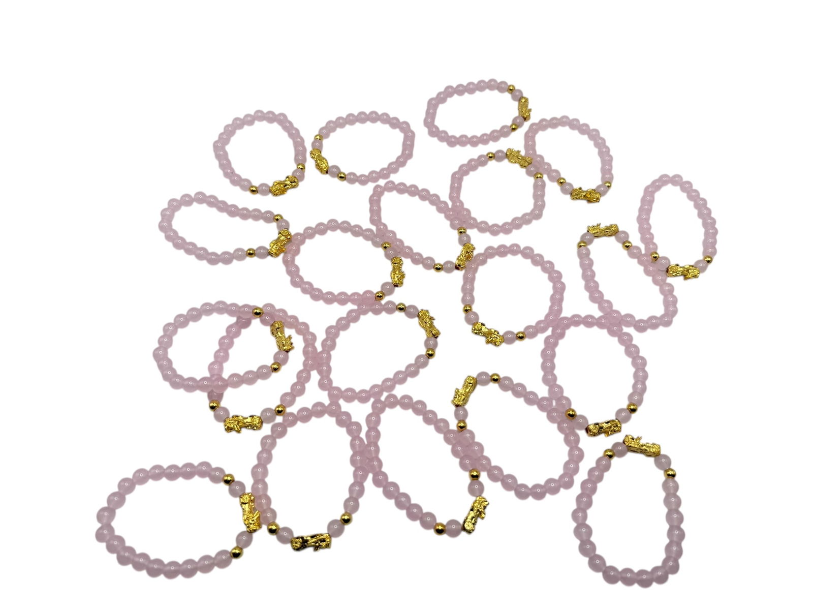 A Group of Twenty Pink Bead Bracelets with Gilt Pi: A Group of Twenty Pink Bead Bracelets with Gilt Pil: 31/2 inches