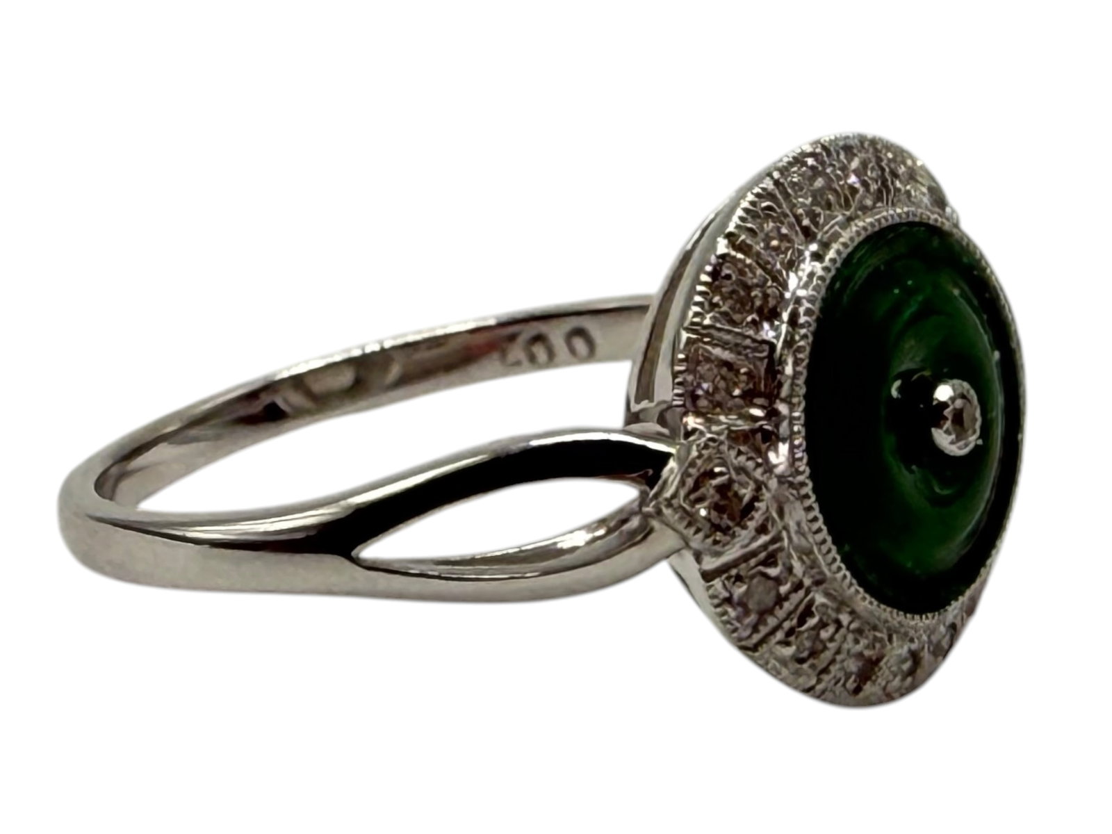 18K White Gold, Jadeite and Diamond Ring: Size: 5.5 Set with a circular jadeite cabochon within a diamond-set surround, mounted on a white gold band.