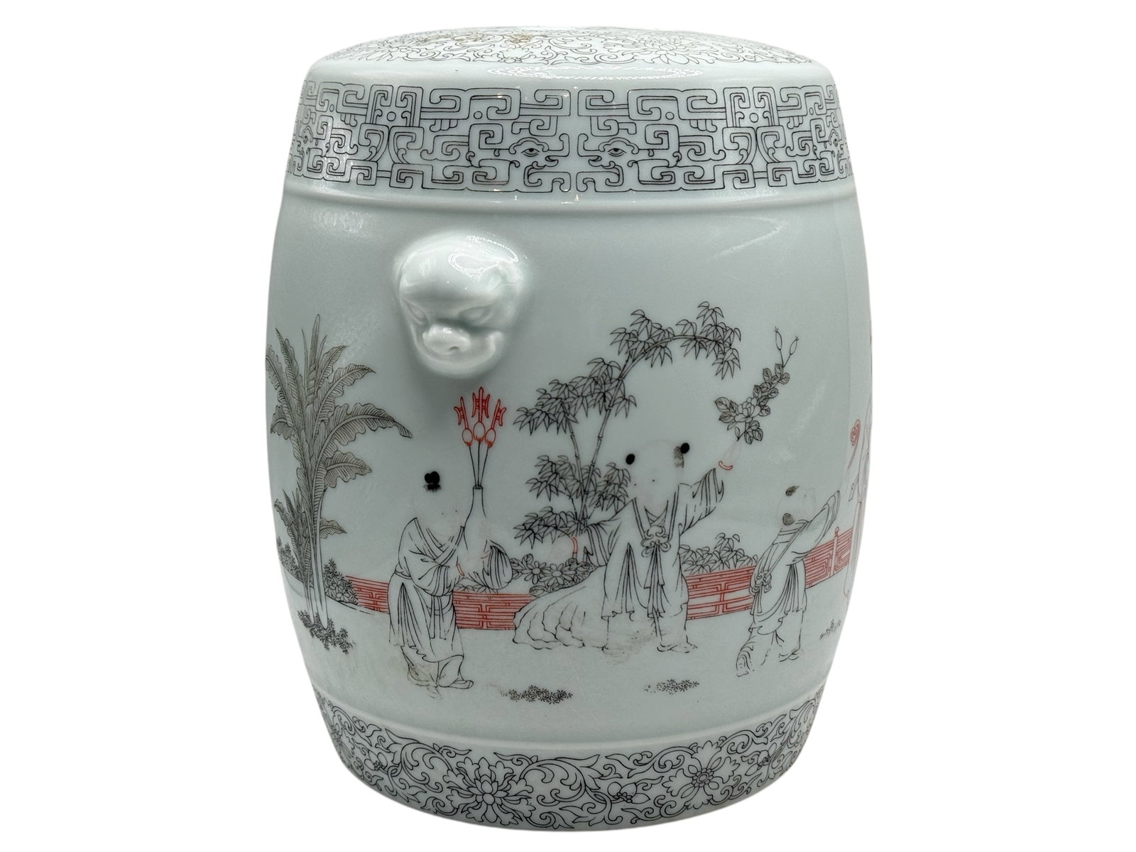 A Chinese Famille Rose Porcelain Incense Burner: Decorated with figures in a garden landscape, with lion-mask handles and a pierced cover. H: 7 inches W: 6 1/2 inches