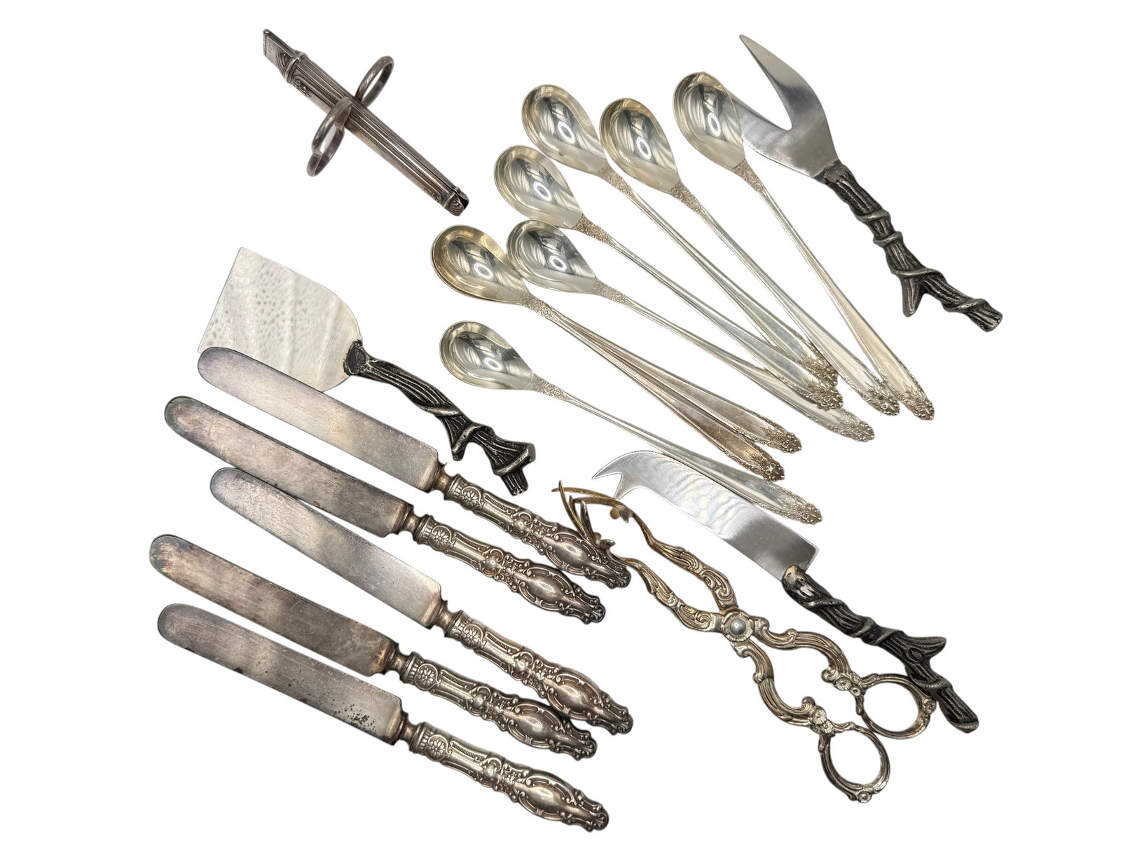 A Group of Assorted Silverplate Flatware and Servi: Including spoons, butter knives, serving pieces, tongs, a cheese server, and a cocktail sword, various patterns and makers. L: 7 7 1/2 inches
