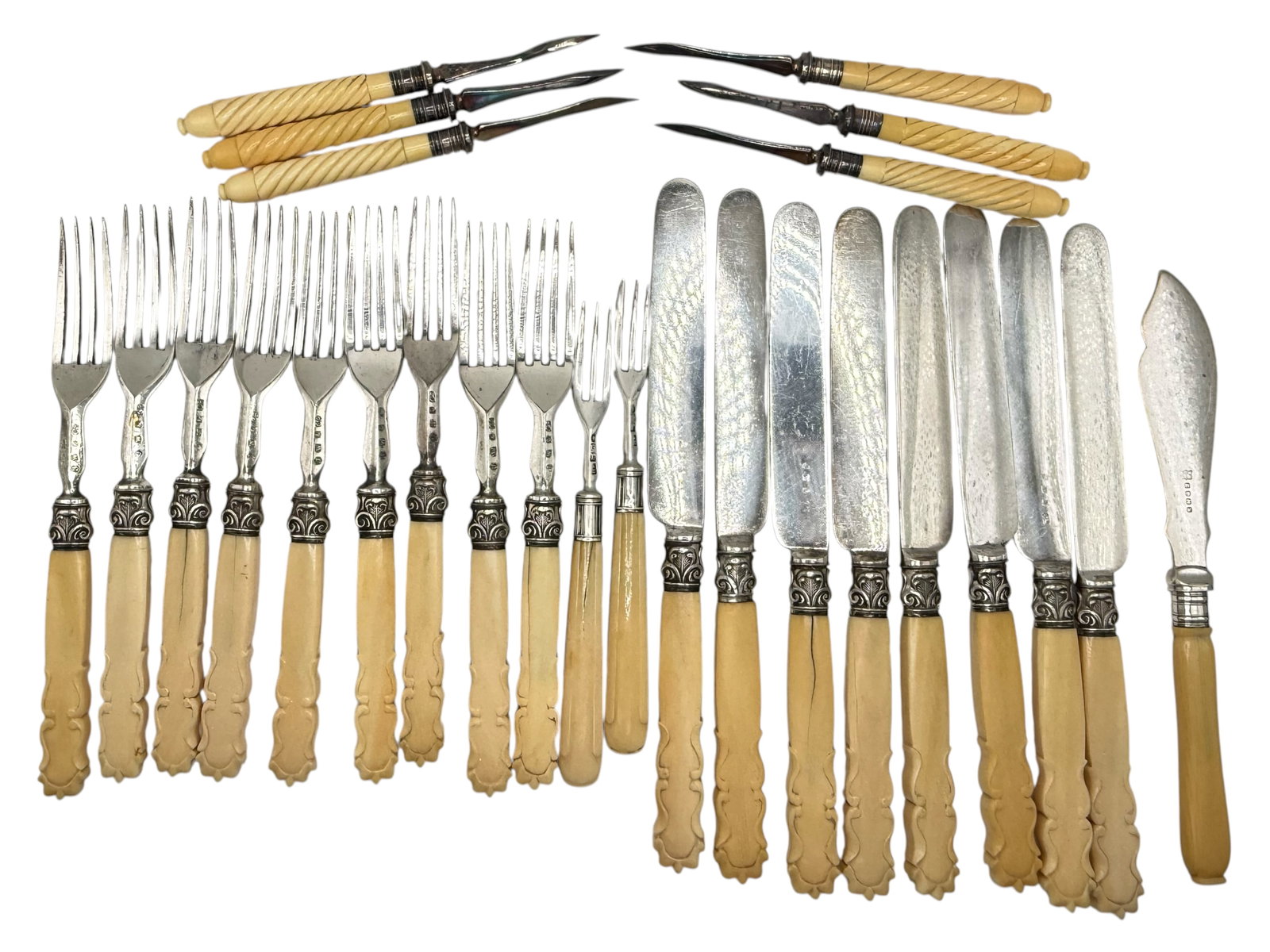 A Group of Silverplate Flatware: Including bone-handled table knives and forks, carving forks, and butter spreaders, some with hallmarks L: 8.5 inches