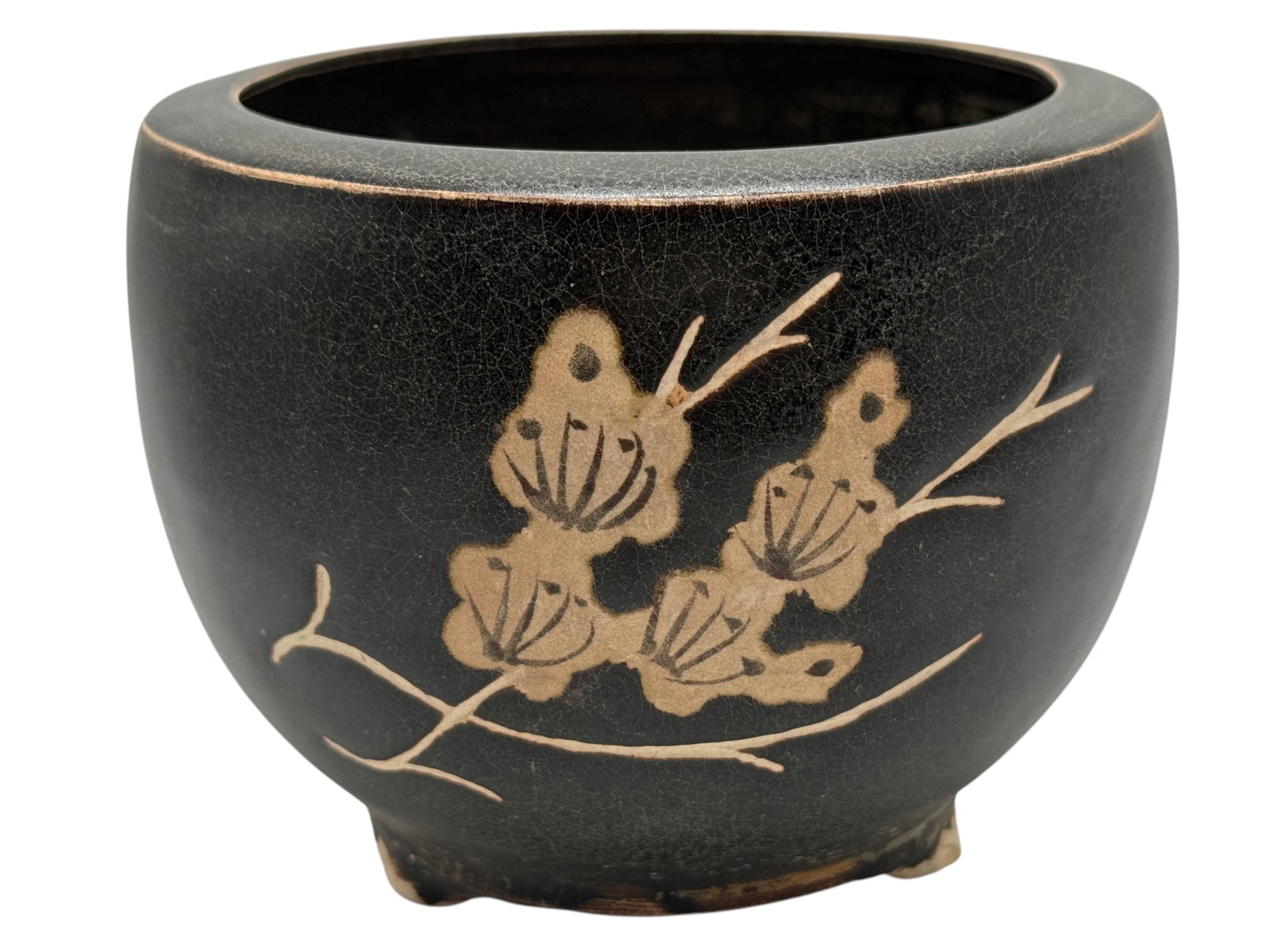 A CARVED 'BLACK- AND WHITE'-GLAZED CIZHOU STONEWAR: H: 4 inches W: 5 inches