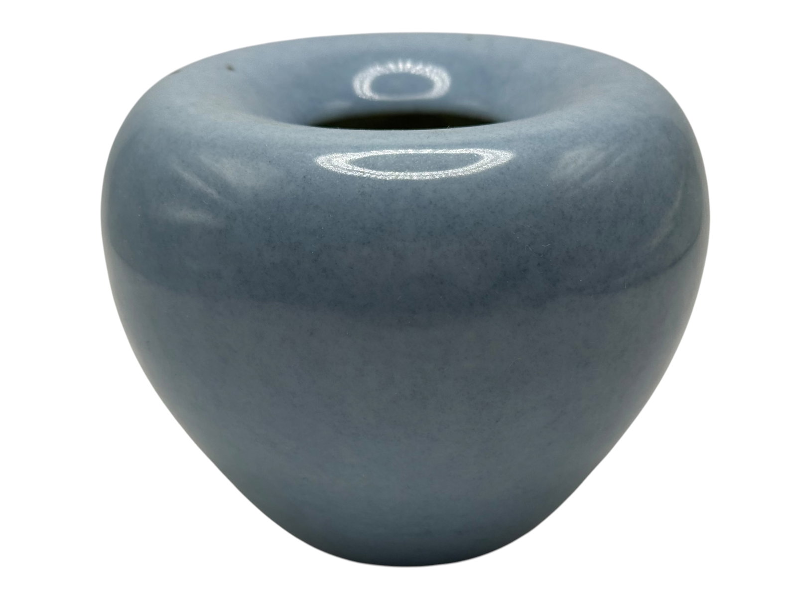 A Chinese Clair-de-Lune-Glazed Water Pot: Of compressed globular form with a recessed mouth, covered in a pale blue glaze, the base with an underglaze-blue six-character mark. H: 3 1/2 inches W: 4 inches