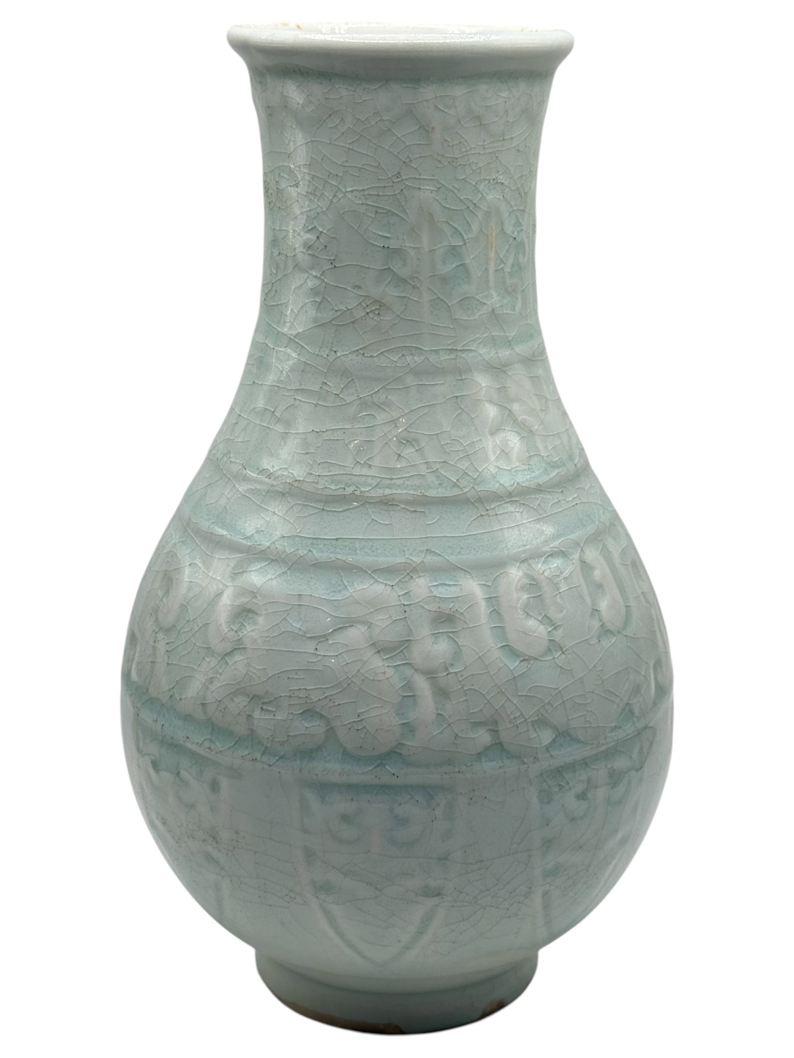 A Chinese Celadon Glazed Relief-Decorated Vase: Baluster form, molded in relief with a band of scrolling dragons and stylized borders beneath a crackled celadon glaze. H: 9 1/2 inches W: 5 inches