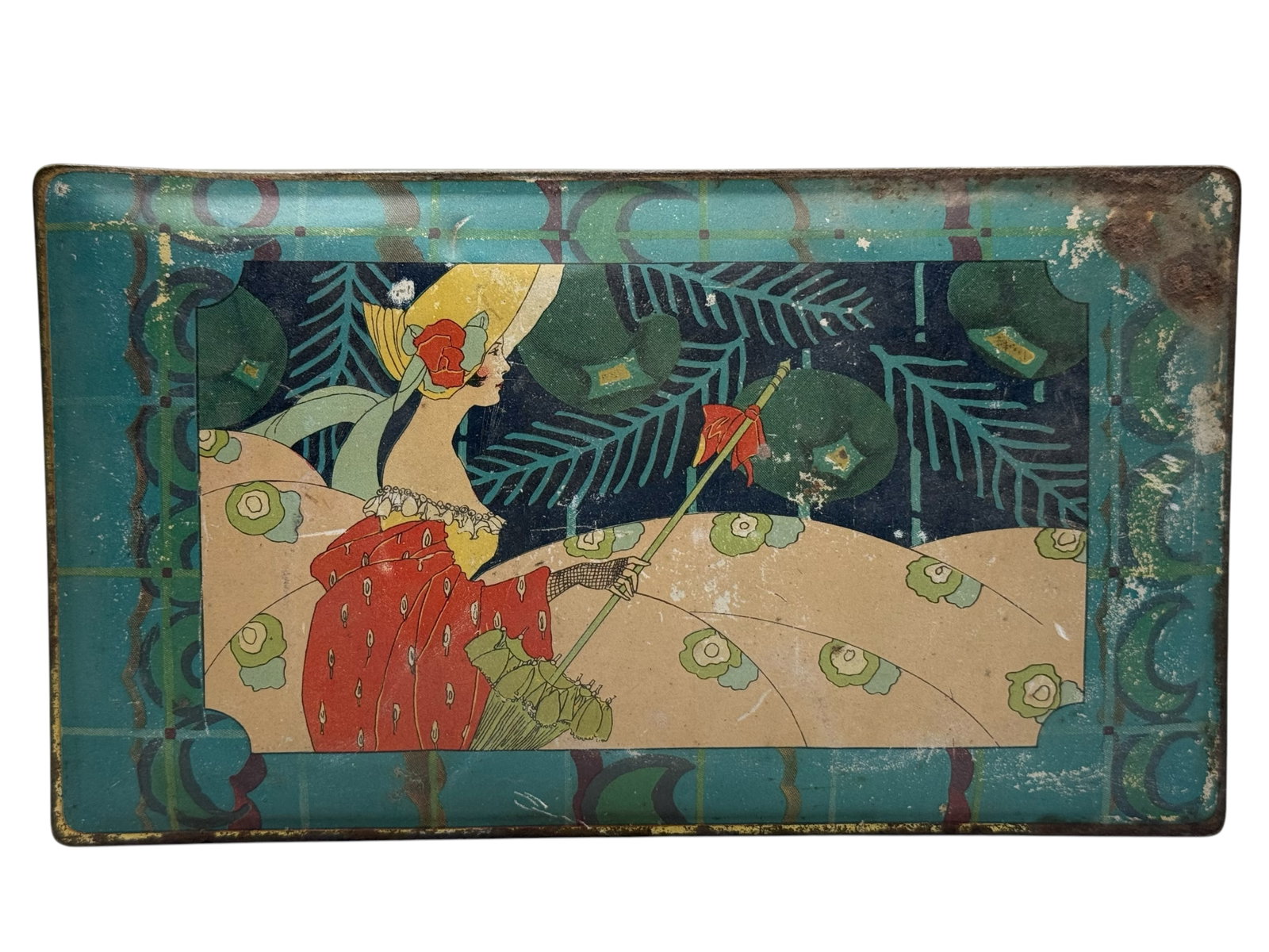 An Art Deco Canco Tin Advertising Tray: Rectangular form, decorated with a stylized female figure. H: 2 1/2 inches L: 8 inches W: 4 1/2 inches