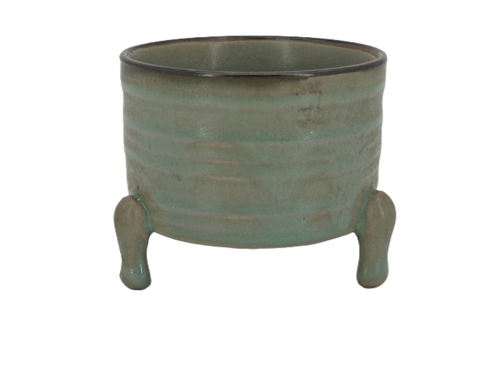 A Chinese Celadon-Glazed Tripod Censer: Of cylindrical form raised on three cabriole legs, covered in a celadon glaze. Size: 2 1/4" * 2 7/8"