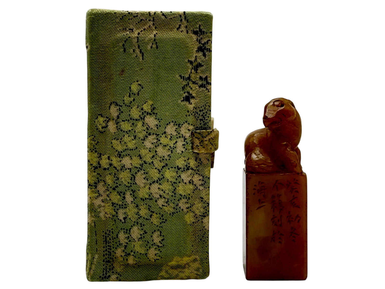 A Chinese Soapstone Seal: Surmounted by a recumbent mythical beast, with inscription to one side. H: 2 1/2 inches W: 3/4 inches
