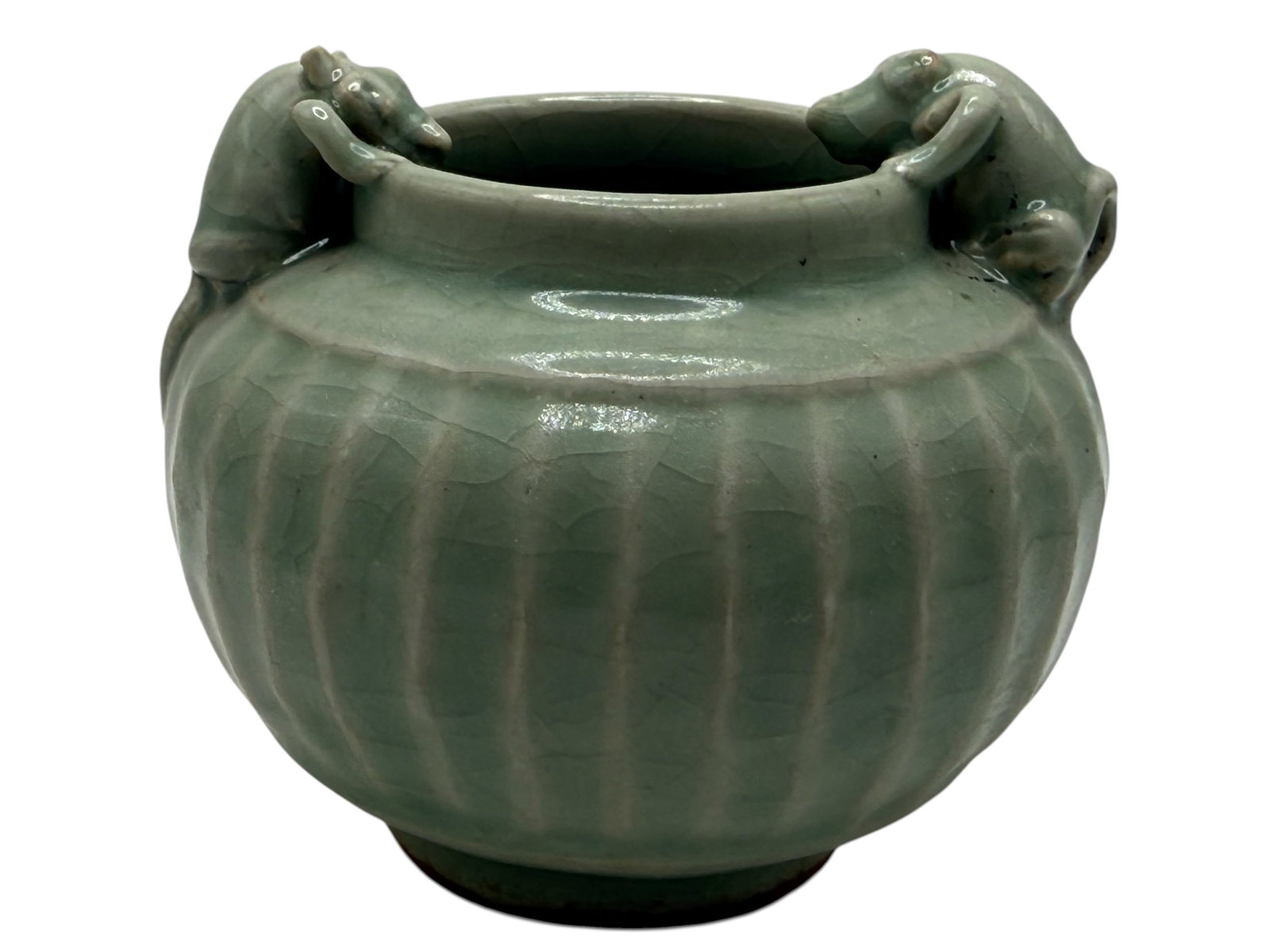 A Chinese Celadon Censer: The compressed body with vertical fluting, flanked by a pair of elephant-form handles H: 3 1/4 inches W: 4 1/4 inches