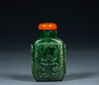 Jade relief animal snuff bottle