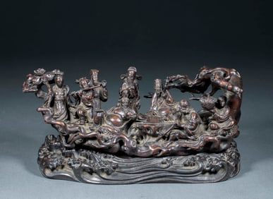 A rosewood "Eight Immortals Crossing the Sea" decorative piece