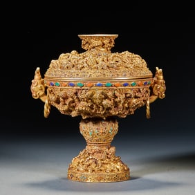 A silver-gilt vessel with two beast-ear-shaped handles and bomb? beads