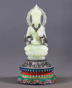 A silver-inlaid jade Buddha statue: A silver-inlaid jade Buddha statue: Made of jade and silver, it features a silver-inlaid technique and depicts the image of a Buddha. Judging from the craftsmanship, it might be a product of the Qing