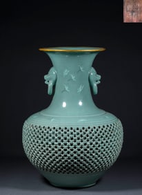 A Korean celadon bottle with pierced ears and silver-inlaid mouth from the Qianlong period of the