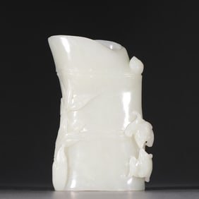 A jade bamboo-shaped pen holder from the Qing Dynasty
