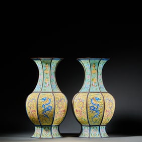 A pair of painted enamel vases with dragon and phoenix patterns and continuous melon and gourd