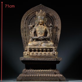 A gilded copper seated statue of Tara