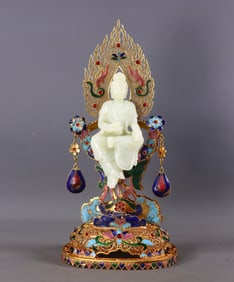 A filigree gilded and inlaid Hetian jade Buddha statue