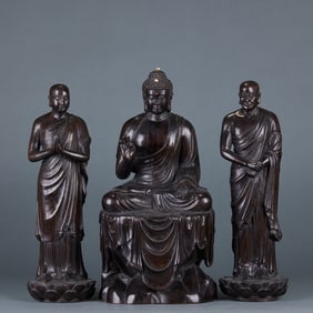A set of three figures in agarwood: Buddha, Ananda, and Kasyapa