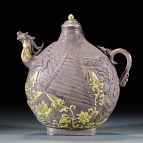 A pure silver teapot with partially gilded phoenix-head