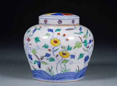 A clear pink and white flower-patterned "sky character" jar