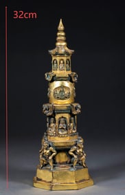 The gilded copper pagoda is illuminated by the Buddha's light