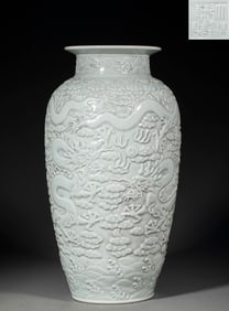 The shadow celadon glazed dragon-patterned cylinder vase was made during the Qianlong period