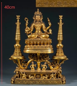 A gilded four-armed statue of Guanyin Buddha from the Yongle period of the Ming Dynasty
