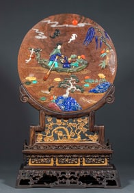 The screen is made of purple sandalwood and golden star stone inlaid with jade