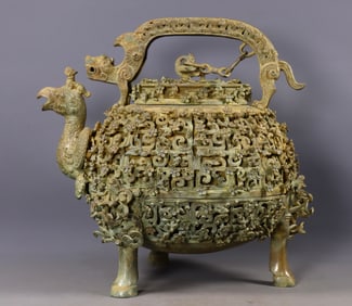 A bronze hollowed-out phoenix-mouthed teapot with coiled viper patterns from the War and Han