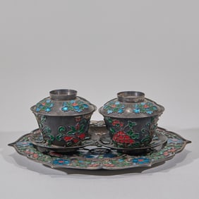 A set of pure silver fired blue flower-patterned tea cups and saucers