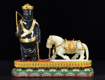 A set of a Hu man leading a horse with jade wrapped in gold from Hetian in the Liao Dynasty