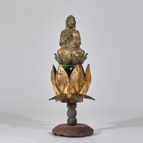 A gilded bronze seated statue of Sakyamuni Buddha before the Ming Dynasty [The seat is made of