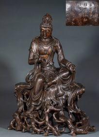 The statue of Guanyin with agarwood at ease